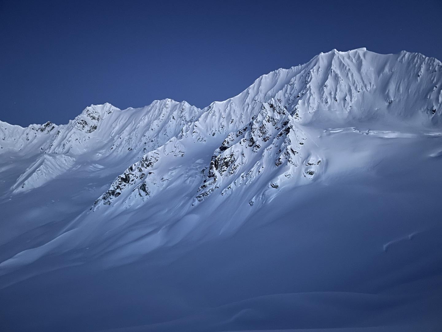 Glaciated mountains at dusk in the Delta Mountains of Alaska