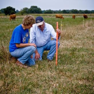 NRCS and producer in field