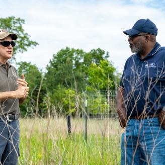 Mark Magura (left), the owner of Leap Frog LLC in Starke County, Indiana, speaks with Indiana NRCS State Conservationist Jerry Raynor May 25, 2021 about the wetland restoration completed on his property through the NRCS' Wetland Reserve Easement Program. The easement includes 200.6 acres of former cropland that were restored to create wetland, prairie and forest habitat for wildlife. (Indiana NRCS photo by Brandon O'Connor)