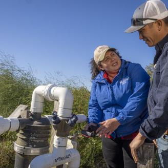 Sang Lee Farms co-owner William Lee and Liz Camps, District Conservationist look over a recenlty-installed Acclima Soil Moisture Sensor for Irrigation Water Management on the farm in Peconic, New York, November 5, 2021.
Sang Lees Farms, transitioning to third generation, grows more than 100 varieties of specialty vegetables, heirloom tomatoes, baby greens, herbs. They continue to feature Asian produce, growing many varieties of Chinese cabbages, greens, and radishes.
The farm has been operating and growin