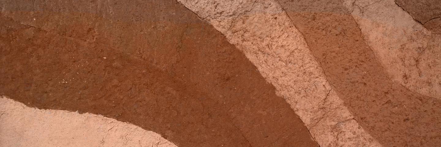 Various colors of soils in strips.