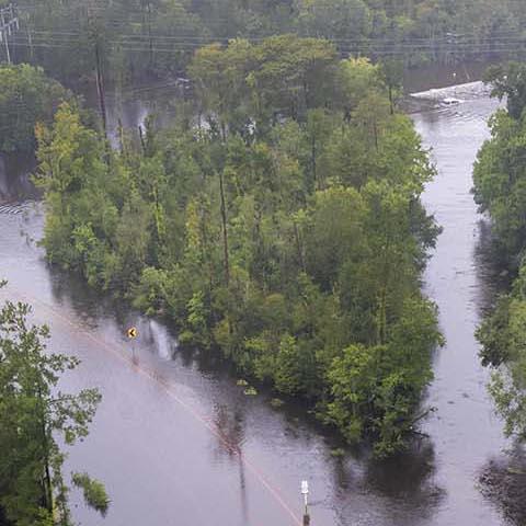 Coast Guard aerial photo of flooded highway in woods of South Carolina, during Hurricane Joaquin in October 2015