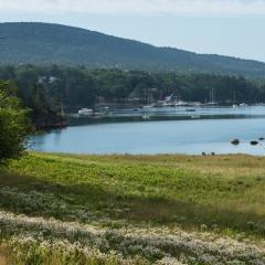 Mt. Desert Island and Ellsworth area, Maine, on July 10, 2018.  The island includes the towns of Bar Harbor, Northeast Harbor and more. Just offshore, outside the Mt Desert harbor, is Bear Island. Ferries and water taxis transport mail, supplies, residents and tourists to the nearby Cranberry Isles (Great Cranberry, Islesford (Little Cranberry), and Sutton.  Cranberry Isles are the five islands of Great Cranberry, Islesford (Little Cranberry), Sutton, Baker and Bear. Buoys dot the surrounding waters where l