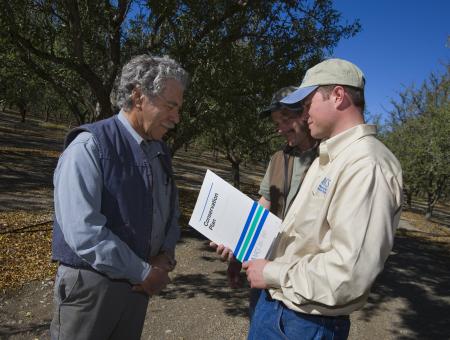 Men with conservation paln.